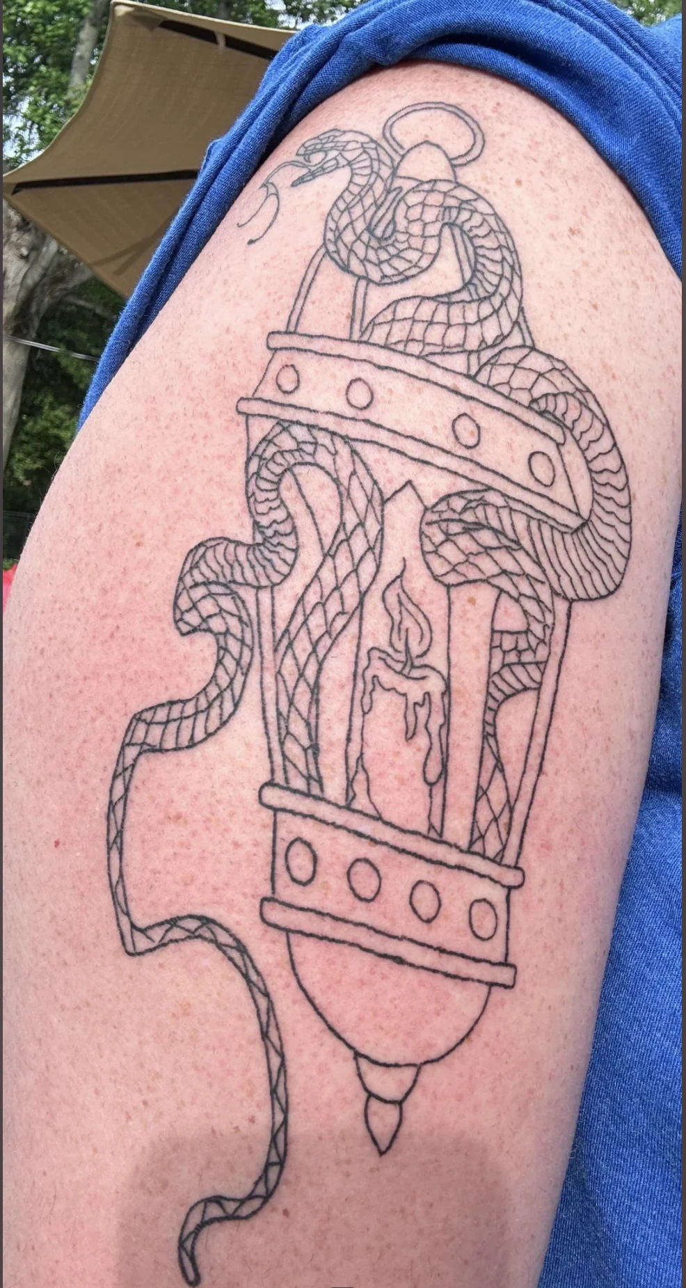 Cover-up tattoo mid-journey removal with both ink layers partially faded
