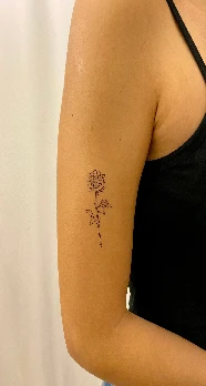 Fine-line low-density tattoo on an arm